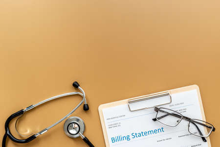 Bill from the doctor with stethoscope. Payment for hospital serviceの写真素材