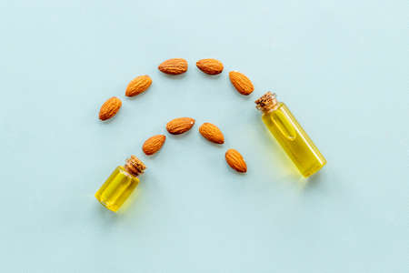 Bottle of almond oil with almond nuts. Extra virgin essence oilの写真素材