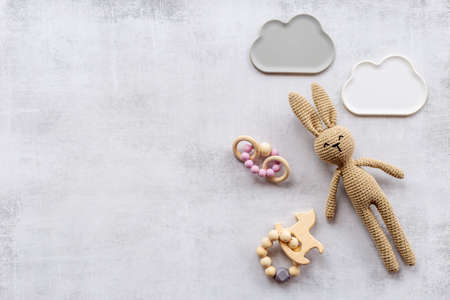 Baby toy rabbit with wooden accessories, overhead viewの写真素材