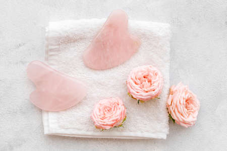 Face massage stone with roses for skin beauty careの写真素材