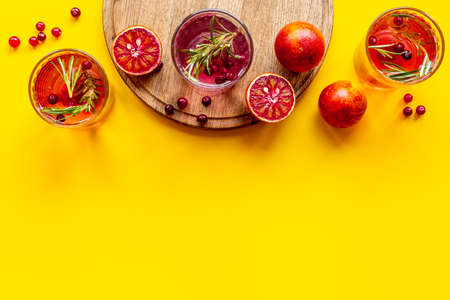 Glasses of refreshing lemonade with cranberries and red orangesの写真素材