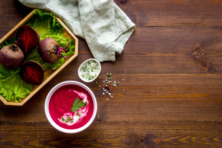 Creamy red beetroot soup with raw beets and sour cream