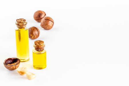 Macadamia essence oil with macadamia nuts. Organic product for food or cosmeticの写真素材