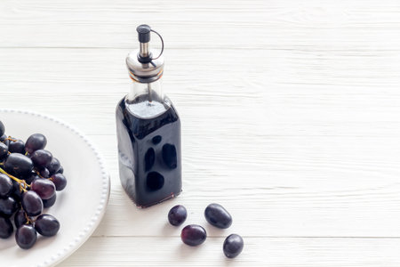 Balsamic vinegar with bunch of fresh grapesの写真素材