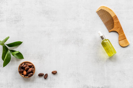 Cocoa oil for hair care with wooden hair brush. Top viewの写真素材
