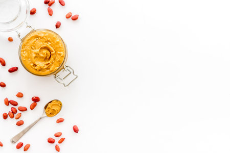 Homemade creamy peanut butter with nuts, top view
