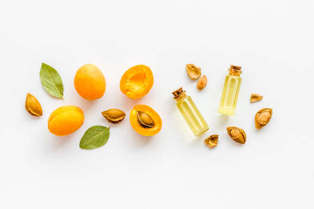 Apricot kernel oil with ripe apricot fruits, top viewの写真素材
