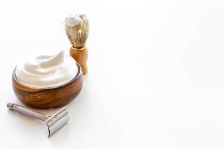 Shaving razor and foam in bowl - barber tools equipmentの写真素材