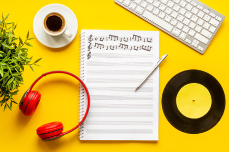 Compose music concept with music sheets and headphones, top viewの写真素材