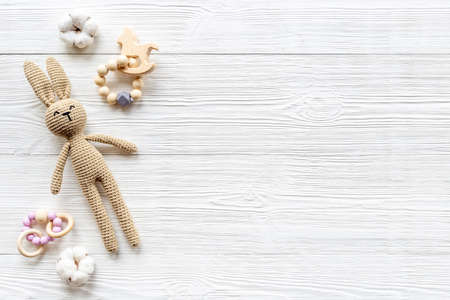 Baby toy rabbit with wooden accessories, overhead viewの写真素材