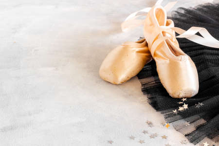 Used ballet pointe shoes on tutu skirt. Set for ballerinaの写真素材