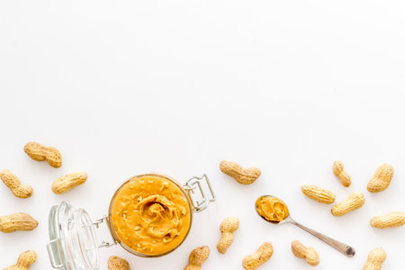 Homemade creamy peanut butter with nuts, top viewの写真素材