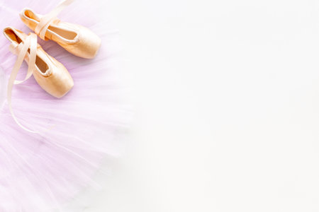 Used ballet pointe shoes on tutu skirt. Set for ballerinaの写真素材