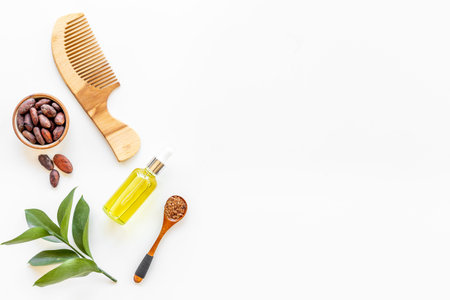 Hair treatment by cocoa oil with hair comb. Top view