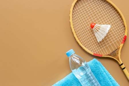 Sports equipment with badminton rackets towel and waterの写真素材