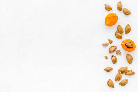 Apricots and apricot pits - dried kernel almond patternの写真素材