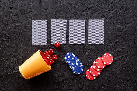 Poker table with gambling chips and playing card. Casino concept