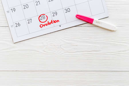 Ovulation home test on calendar with ovulation day red markの写真素材