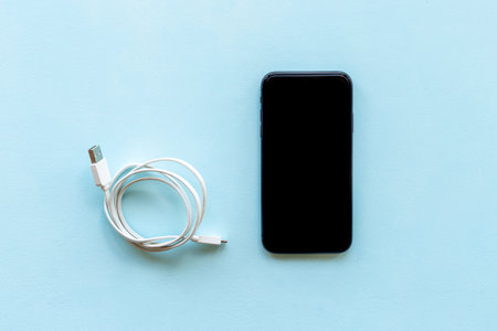 Smartphone with usb cable for charging and cord chargerの写真素材