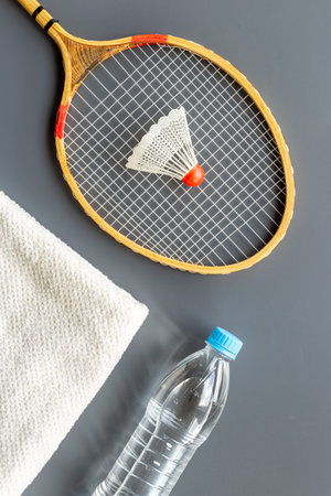 Sports equipment with badminton rackets towel and waterの写真素材