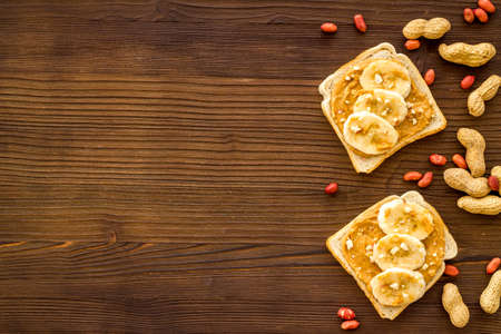 Spread peanut butter sandwiches with nuts. Top viewの写真素材