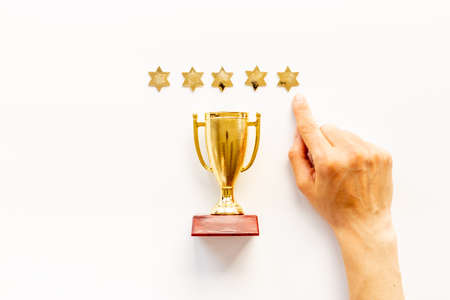 Five stars rating and winner trophy cup. Award and success conceptの写真素材