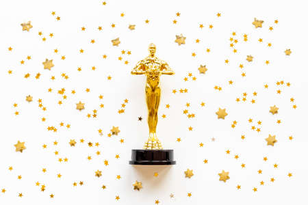 Golden movie award statue with stars - best film winnerの写真素材
