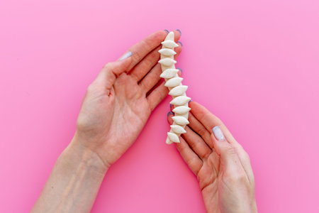 Spine skeleton model in hands. spinal diseases curvature concept