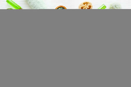 Flay lay of tea cosmetic products with essential oil and green leavesの写真素材