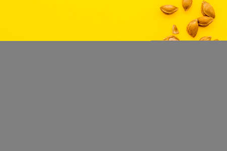 Flat lay of apricot kernel with ripe apricot fruitsの写真素材