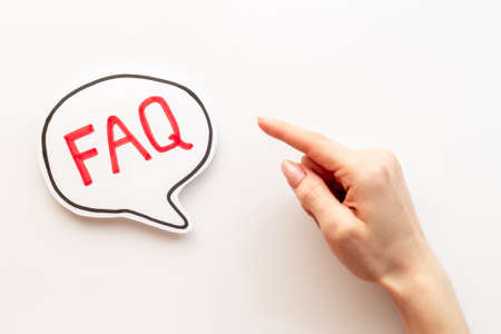 Hands with faq word on paper bubble. Frequently asked questions conceptの写真素材