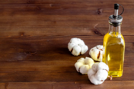 Cotton seeds oil with plant flowers. Essence extra virgin oilの写真素材