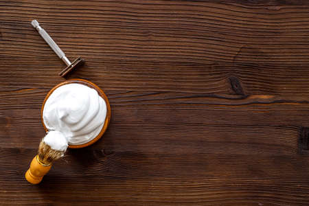 Shaving razor and foam in bowl - barber tools equipmentの写真素材