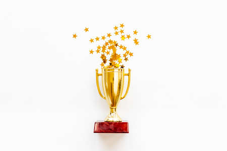 Championship award golden trophy cup with shiny starsの写真素材