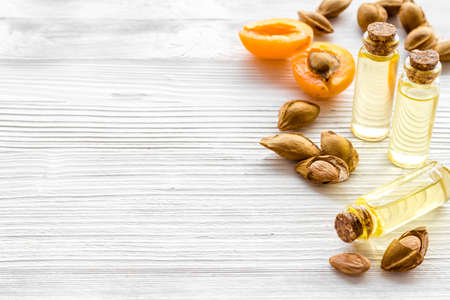 Apricot kernel oil with apricots and dried apricot kernelsの写真素材