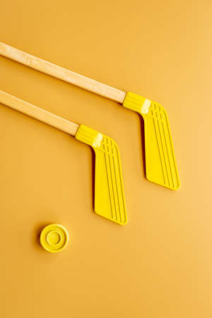 Competitive sports equipment with hockey sticks and puck. Top viewの写真素材