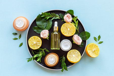 Beauty treatment ingredients layout with cosmetic and flowers