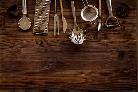 Cooking background with metal kitchen utensils and cookwareの写真素材
