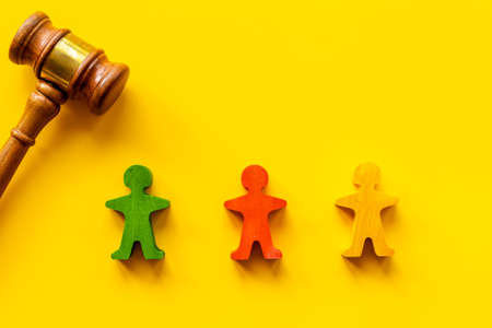 Numan wooden figurines with judge gavel. Resolving conflict situationの写真素材