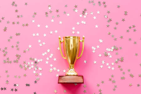Championship award golden trophy cup with shiny starsの写真素材