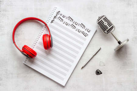 Sheets with music notes and headphones. Compose music conceptの写真素材