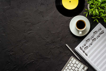 Handwritten music sheets and vinyl record, top view. Compose music conceptの写真素材