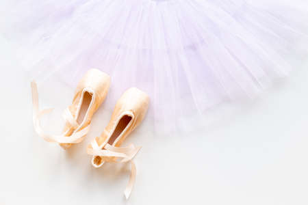 White ballet tutu skirt and beige point shoes with ribbonの写真素材