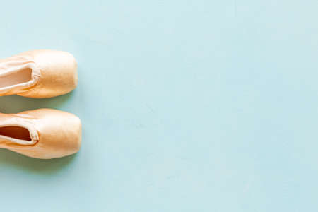 Pair of beige ballet point shoes with ribbon, top viewの写真素材