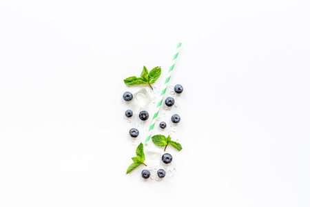 Concept of berries as cocktail or juice glass with cocktail tube