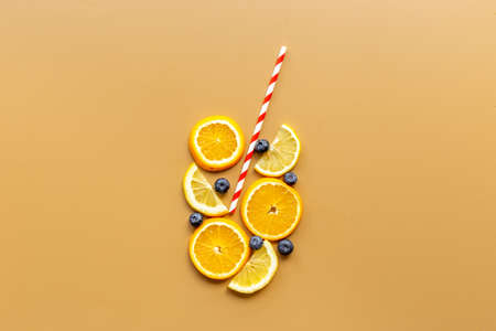 Cocktail concept. Glass of juice made of citrus with cocktail tube