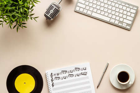 Music sheets with musical notes and microphone, top viewの写真素材