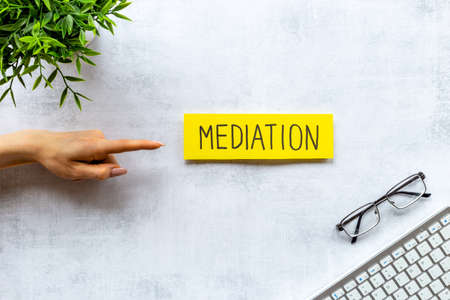 Conflict resolved concept. Mediation word on sticky notes on office tableの写真素材