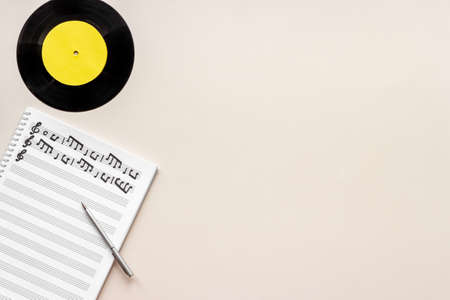 Sheets with music notes and vinyl record. Compose music conceptの写真素材
