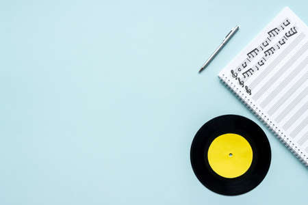 Sheets with music notes and vinyl record. Compose music conceptの写真素材